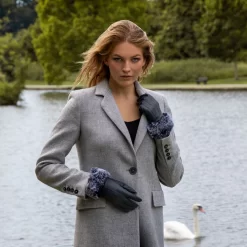 Women’s Touchscreen Three-Point Lined Leather Gloves With Faux Fur Cuffs -Fashion Accessories Shop woman wearing navy leather gloves faux fur cuff